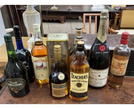 A bottle of Three Barrels Rare Old French Brandy together with a bottle of Famous Grouse, three bottles of Teacher's Whisky, 