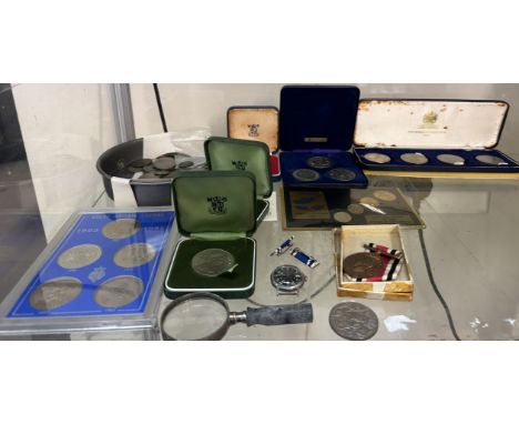 A collection of coins including Crowns and other World coins as well as a Timex wristwatch, medals etc 