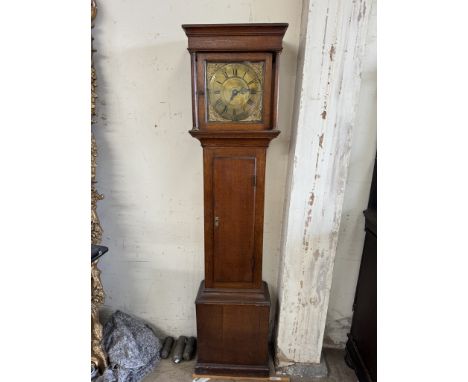 An 18th century and later oak longcase clock, with a moulded cornice Ionic columns and a long trunk door on a box base and pl