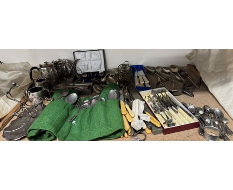 An electroplated four piece tea service together with assorted electroplated flatwares, toast rack etc 