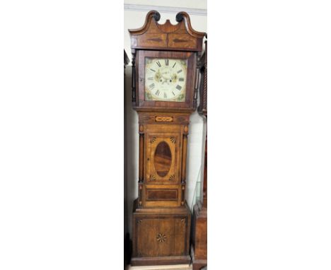 A 19th century oak and mahogany longcase clock, the hood with a broken swan neck pediment and turned columns above a short tr