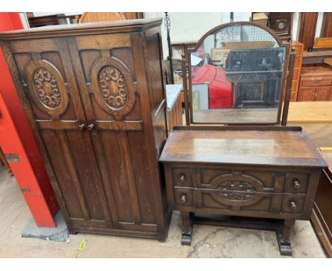 A 20th century oak wardrobe and matching dressing table 