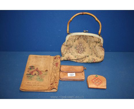 A tapestry bag, a child's leather writing case and leather purses.