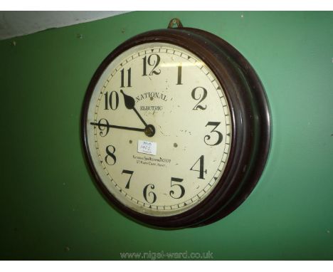 An electric movement Bakelite cased Railway waiting Room Clock having a cream coloured face with Arabic numerals, marked ''Na