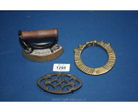 A mini Iron with stand and a brass African bangle.