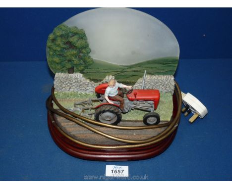 A Border Fine Arts Studio model, A 7687 Dawn till Dusk, Table Lamp backlit featuring MF35 Tractor.