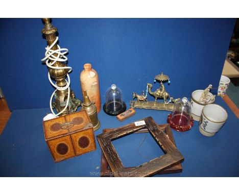 A box of mixed items including brass lamp, tin, brass camel, etc.,