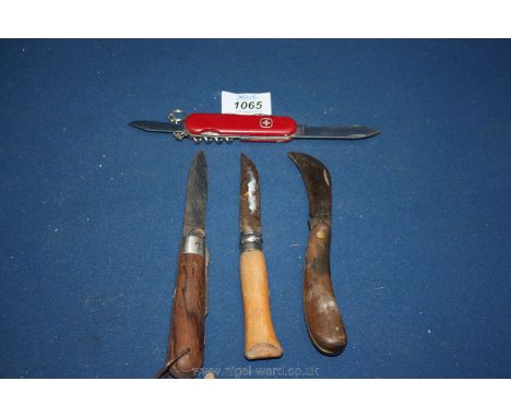 Four Penknives including Swiss army knife.