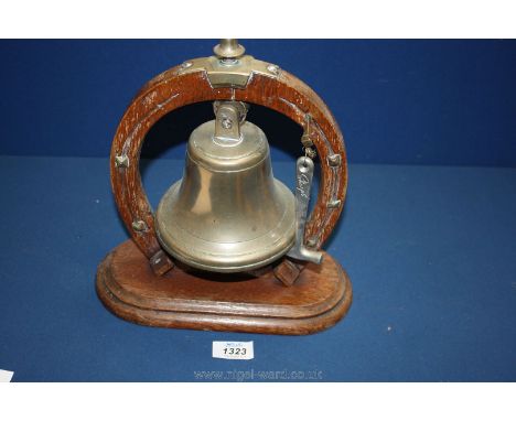 An Oak and brass dinner Gong, the knocker being a toffee hammer.