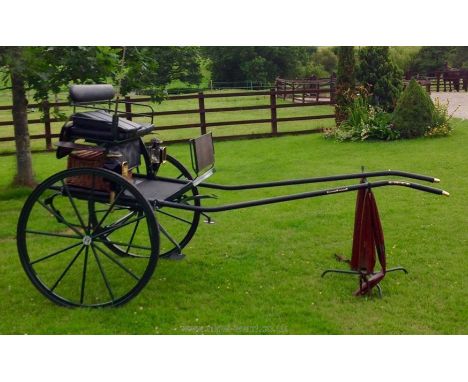 A Dartmoor two wheel Gig; good condition in it's original dark green paint, with steel 12 spoke wheels, 41'' diameter, solid 