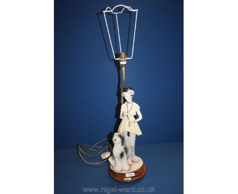 A table lamp with resin flapper style girl plus an Old English sheepdog.