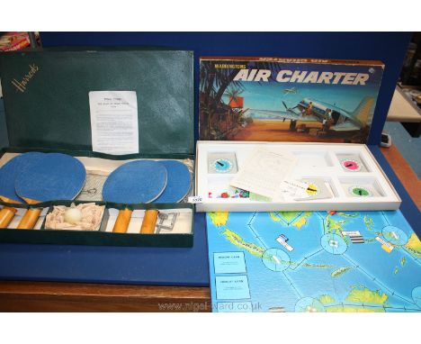 A Harrods 1950's table tennis set and 1970's Air Charter game