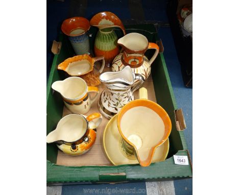 Eight colourful Myott Jugs in various patterns a/f. including a silver lustre jug and a bowl, a/f.