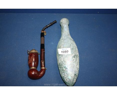 An Oxford Street Schwepps Hamilton bottle and a carved pipe.