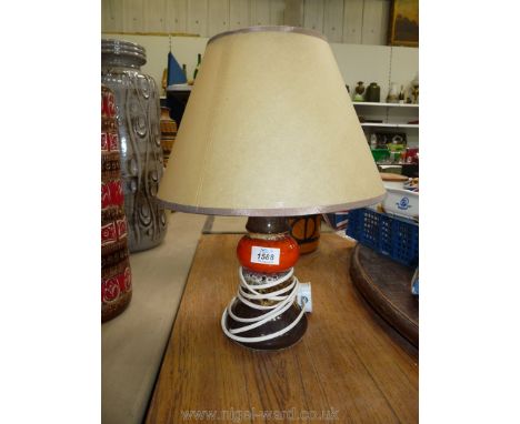 A retro orange, 1970's, brown Stone jar lamp.