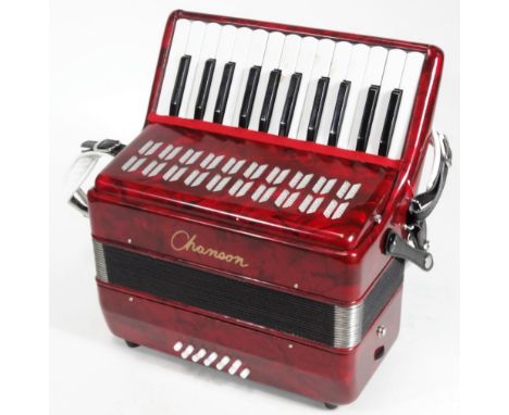 A Champion piano accordion, in red and black trim, 36cm W. (cased)