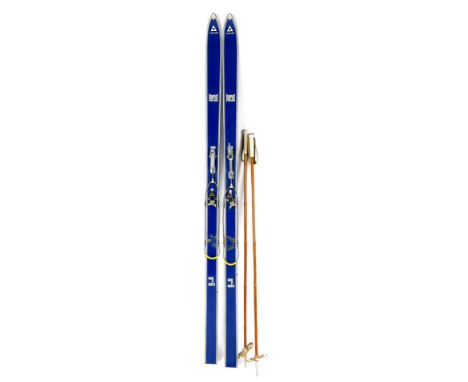 A set of early 20thC vintage Fischer tourist skis, blue, 200cm W.