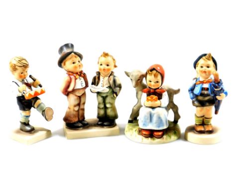 Various Goebel Hummel figures, girl with lamb, 11cm H, drummer boy, etc. printed marks beneath.  (4)
