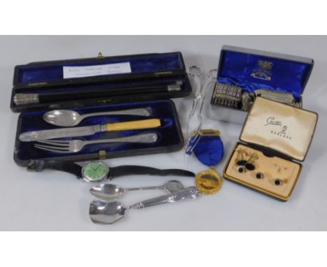 Various silver and silver plated ware, to include a silver topped conductors baton, silver plated salad servers, a silver han