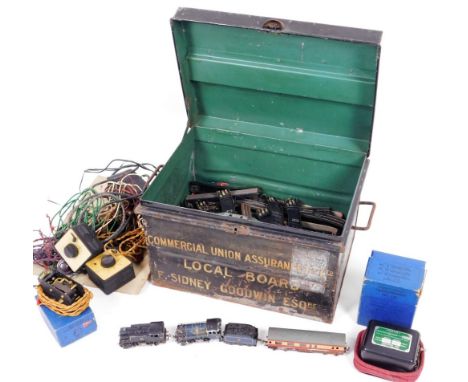 A 20thC Tri-ang and other train set, Meccano transformer, various other wires, accessories, carriages, etc. contained in a ti