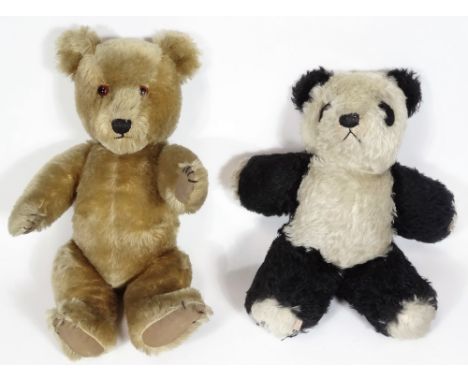 A mid 20thC British blond plush jointed Teddy bear, probably Merrythought, with glass eyes and pads to the arms and feet, 45c