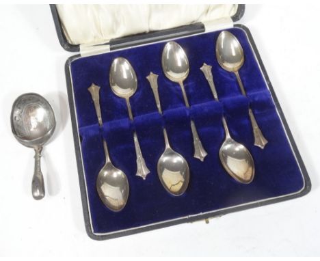 A George III silver caddy spoon, Fiddle pattern, with shaped partially etched bowl, Birmingham 1816, 9cm W, and a cased set o