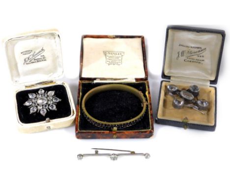 Various Victorian style brooches, comprising a silver flower brooch, set with white paste stones, 4cm wide, a silver and five