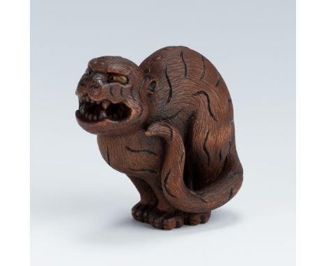 VADYM PYVOVAR: A BOXWOOD NETSUKE OF A SNARLING TIGERBy Vadym Pyvovar, signed with the artist's initialsUkraine, 2023Carved in