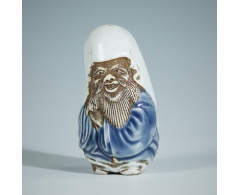 A FINE HIRADO PORCELAIN NETSUKE OF FUKUROKUJUUnsignedJapan, 19th century, Edo period (1615-1868)The God of Longevity carved s
