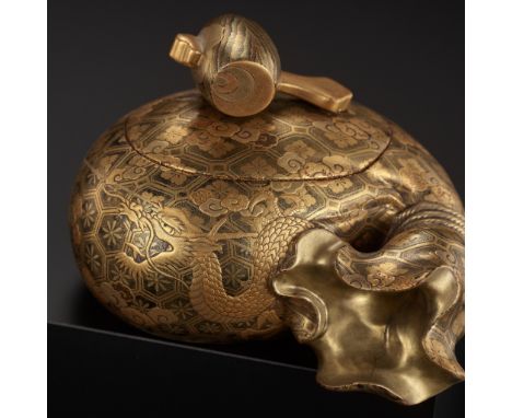 A GOLD LACQUER BOX AND COVER DEPICTING TAKARAMONO (LUCKY OBJECTS)Japan, 19th centuryWell modeled as a large sack covered with