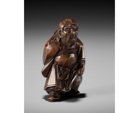 A FINE ITTOBORI WOOD NETSUKE OF SHOKI, CARVED FOR THE TANGO-NO-SEKKU FESTIVALJapan, Meiji period (1868-1912)The finely staine