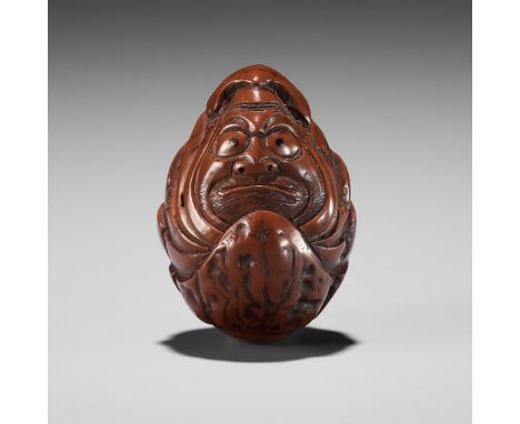 A KURUMI (WALNUT) NETSUKE OF A ROLY POLY DARUMAUnsignedJapan, Iwashiro, 19th century, Edo period (1615-1868)A fine and humoro