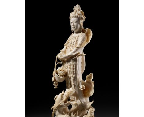 RYUMIN: AN IMPRESSIVE TOKYO SCHOOL IVORY OKIMONO OF SHO-KANNON WITH DRAGONBy Kawai Ryumin, signed Ryumin with seal SanJapan, 