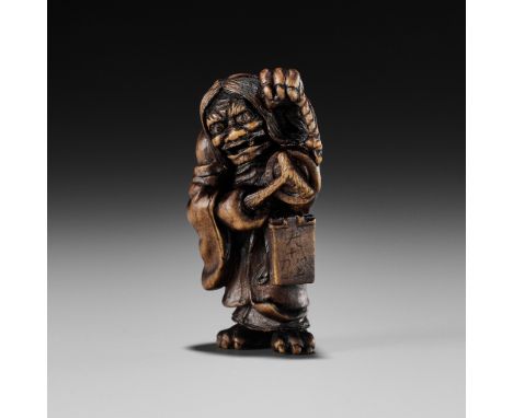 ALEXANDER DERKACHENKO: A BOXWOOD NETSUKE OF ONI NO NEMBUTSUBy Alexander Derkachenko, signed with the artist's signature Ukrai