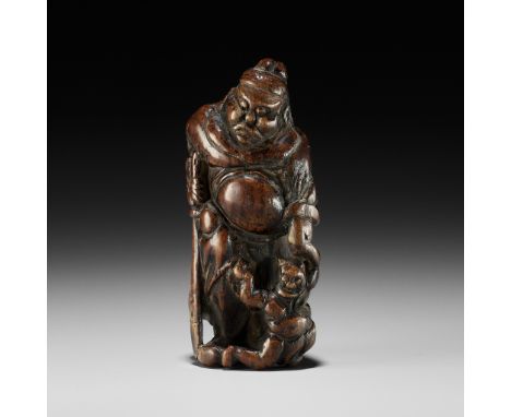 A FINE CYPRESS WOOD (HINOKI) NETSUKE OF SHOKI AND ONIUnsignedJapan, late 18th to early 19th century, Edo period (1615-1868)Bo
