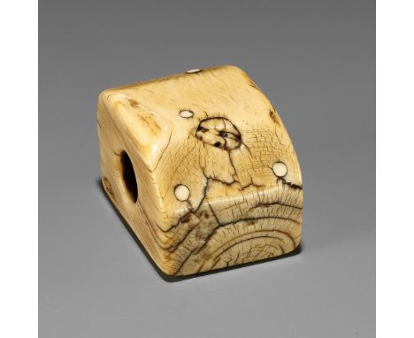 A RARE IVORY NETSUKE OF AN ONI HIDING IN A BOX DURING SETSUBUNUnsignedJapan, 18th century, Edo period (1615-1868)Crammed into