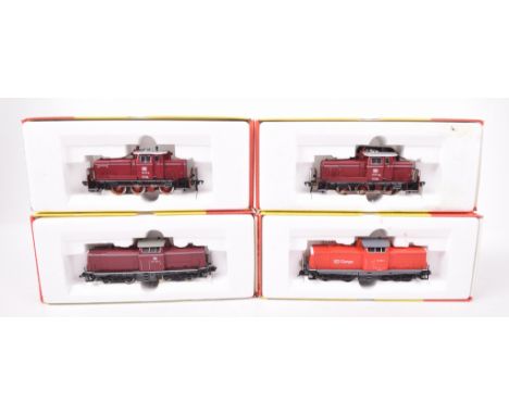 Four boxed Fleischmann HO gauge diesel locomotives4215 in red DB cargo livery, 4225 in maroon DB livery x2 and 4230 in maroon