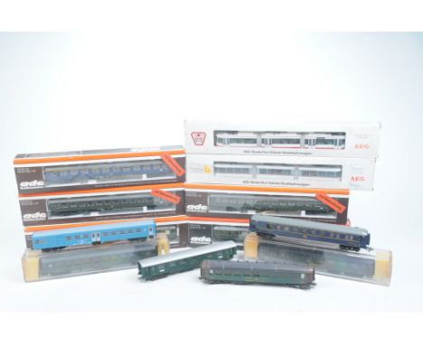 Five boxed Ade coachesTwo in green DB livery, one in blue DB livery and two in green US Army livery, two AEG triple articulat