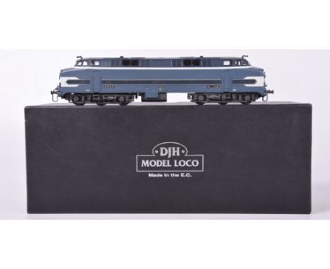 A boxed DJH model locomotive HO gauge E213 K3CC65001 diesel locomotive In light and dark blue SNCF livery.