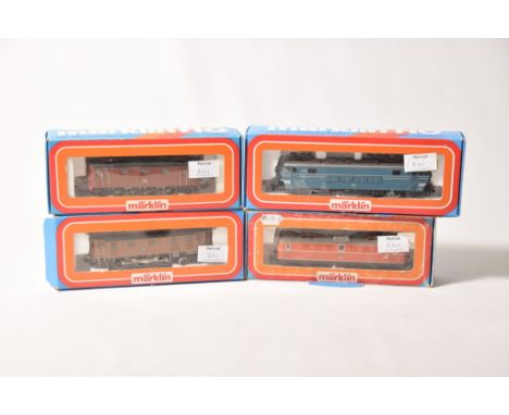 Four boxed Marklin HO gauge electric locomotives3151 no. 10460 in brown livery, 3152 no. 1605 in blue, green and silver liver
