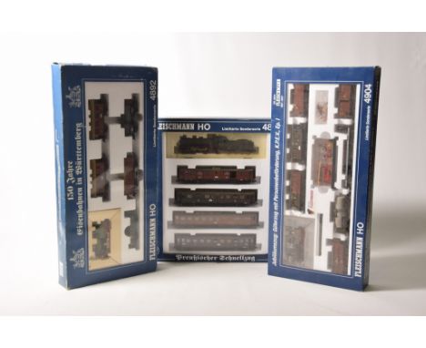 Three boxed Fleischmann HO gauge setsComprising 4898 set containing 4-4-0 locomotive with eight wheel tender in dark green li