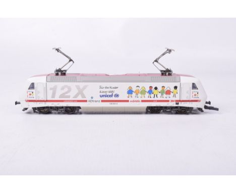 An unboxed Marklin HO gauge twin bogey electric locomotive - metalIn silver AD Tranz Marklin livery.