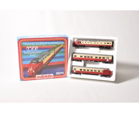 A boxed Marklin HO gauge set No. 3071 Trans Europ Express with diesel locomotive, central coach and dummy coach section in re