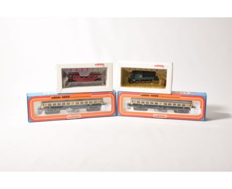 Four boxed Marklin diesel locomotives3459 Serie 80 diesel shunter, 8304 Michelian in white boxes and 2x 8328 blue and cream/b