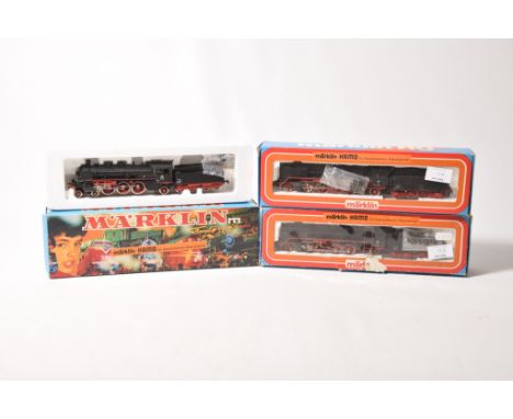 Three boxed Marklin Hamo locomotives and tenders8393 4-6-2 locomotive with eight wheel tender in DB livery, 2 x8382 2-8-2 loc