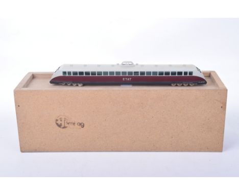 A boxed smf ag HO gauge Bugatti Etat diesel rail carIn purple and light grey livery.