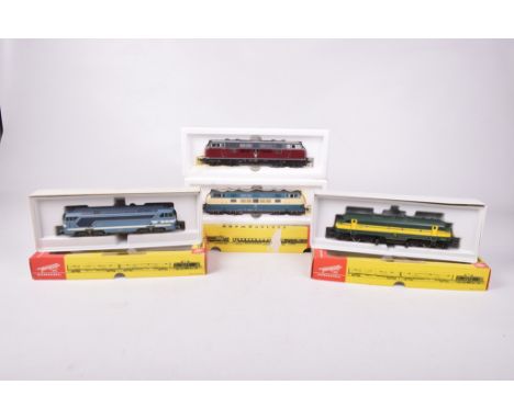 Four boxed Fleischmann HO gauge diesel locomotives4235 in maroon and dark grey DB livery, 4270 in green and yellow livery, 42