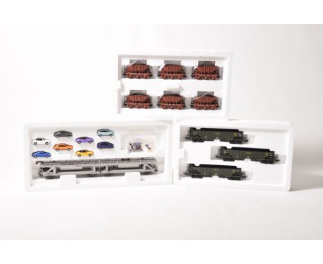 Six boxed Trix HO gauge goods setsComprising 24237 and 24238 each containing six Hopper wagons, 24041 containing drum wagon a