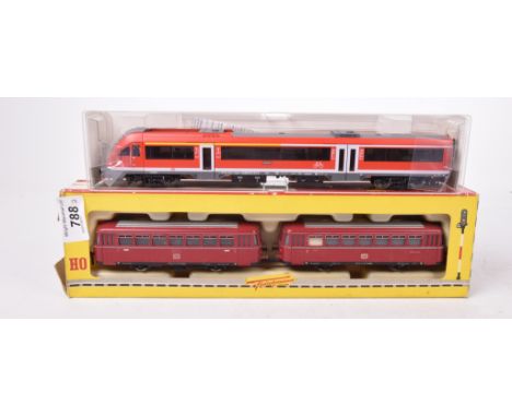 Two boxed Fleischmann HO gauge items Comprising 1372/2 1374/2 two section diesel rail car in maroon DB livery and diesel rail