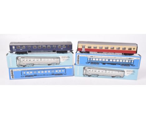 Twenty five boxed Marklin HO gauge coachesIncluding nos. 4049, 4071, 4072, 4073, 4076 etc in blue and white card boxes.